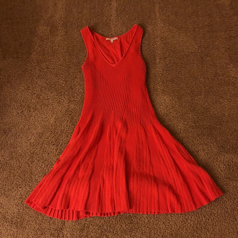 Super cute orange mini flared dress.